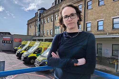 Alison Bennett outside ambulances