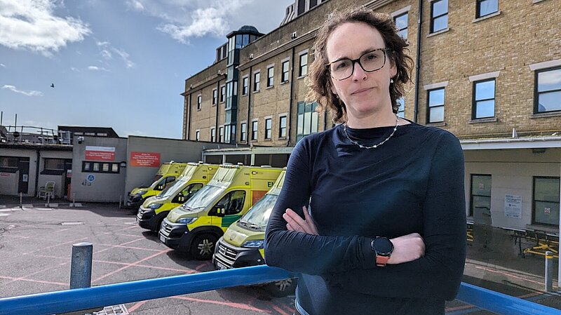 Alison Bennett outside ambulances