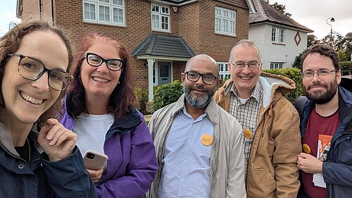Alison and Canvassers on the street in Haywards heath infront of a house