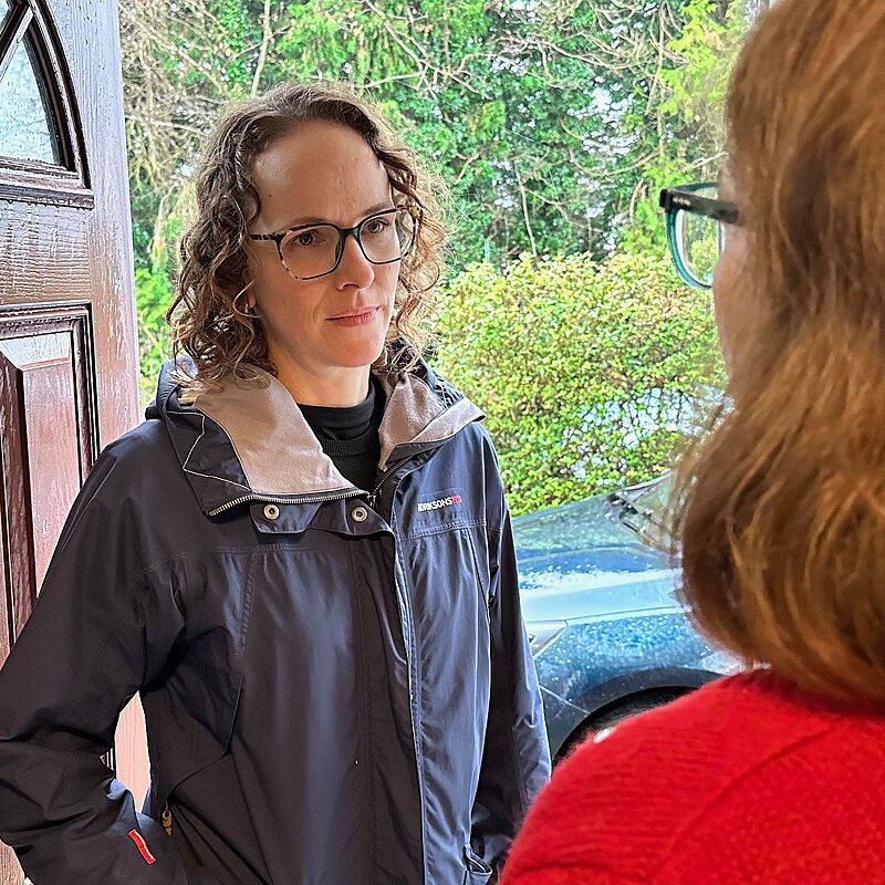 Alison speaking to a resident on the Doorstep