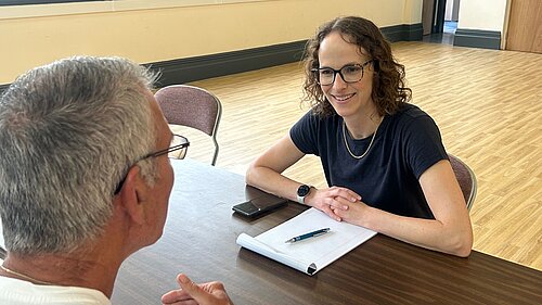 Alison speaking to a constituent 