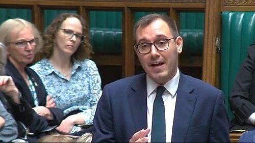 Alison Bennett listening to the debate in the House of Commons today while her Liberal Democrat colleague, Tom Gordon MP, speaks