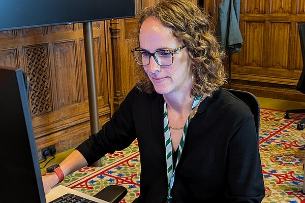 Alison on a computer in her Parliament office