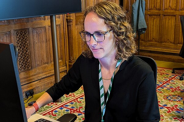 Alison at a computer in Parliament