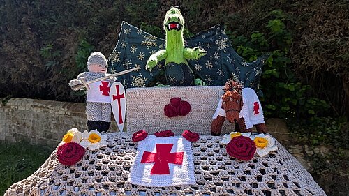 St George & Dragon spotted in crochet in Bolney above a post box made from bricks