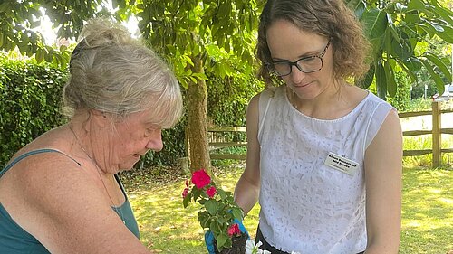 Alison and resident potting on at HHTC Carers Day