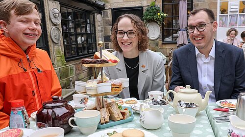 Alison Bennett MP and Tom Gordon MP in front of afternoon tea talking to Young carers