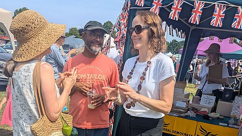 Alison and Cllr Billah at Lindfield Village day talking to local people infront of the Lib Dem Stall