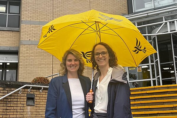 Alison and Jess Brown-Fuller with an umbrella